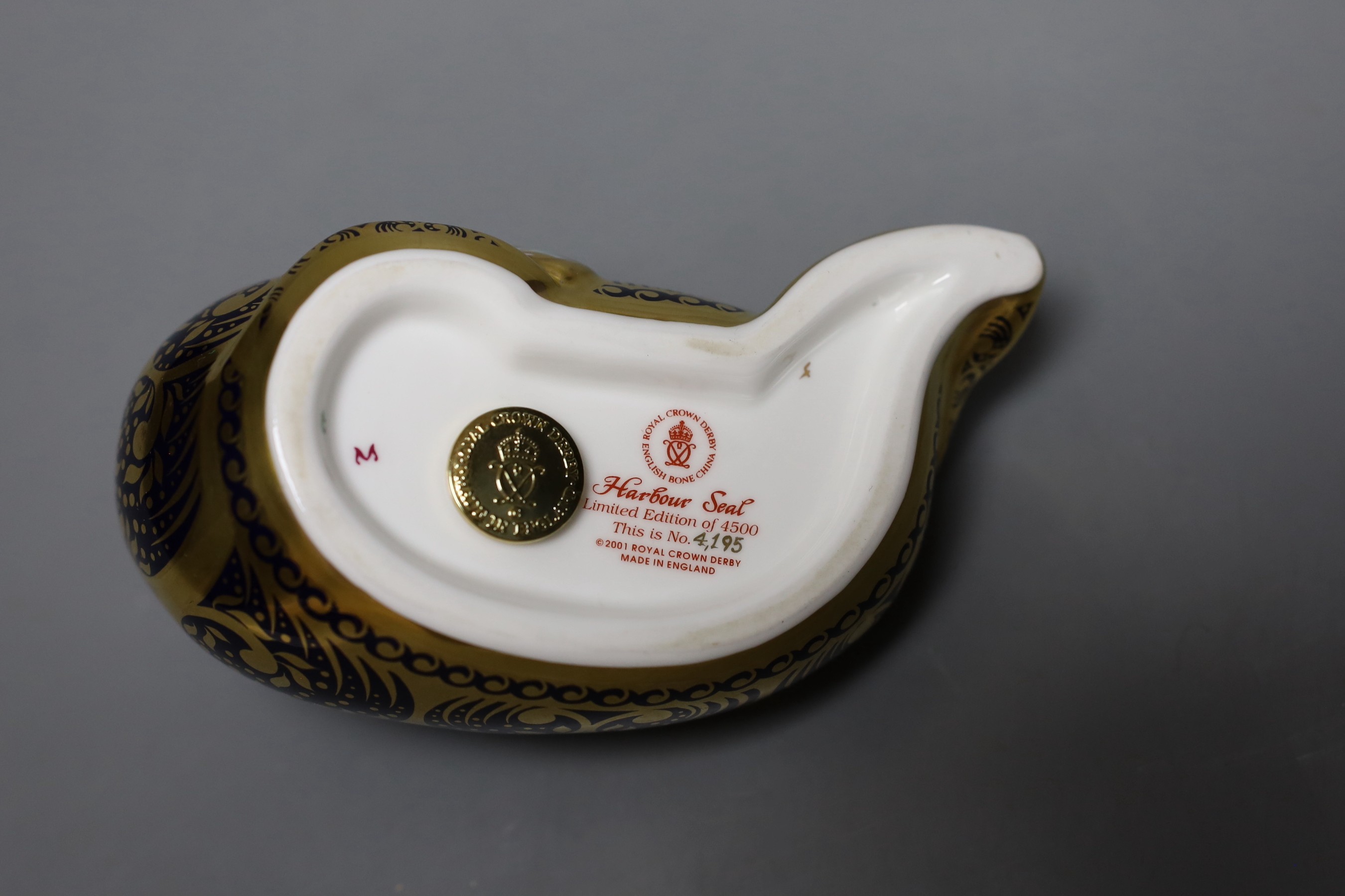 A Royal Crown Derby paperweight - Harbour Seal, gold stopper, boxed with certificate